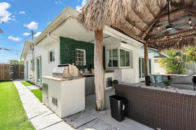 a kitchen with a refrigerator and a stove
