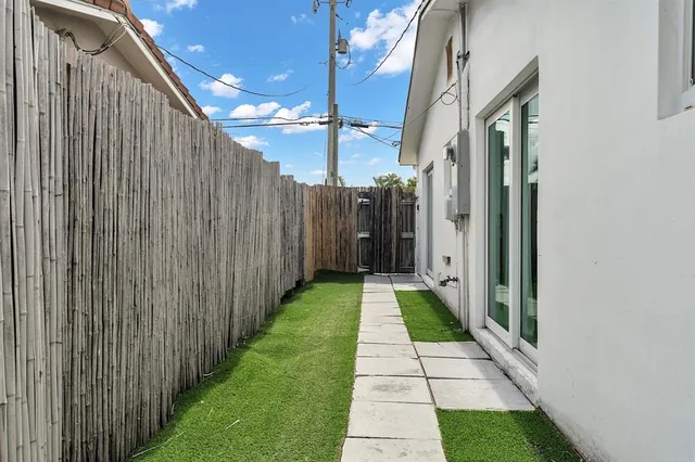 a view of a swimming pool with a lounge chair