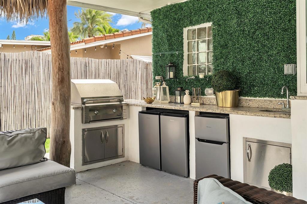 2233 Southeast 15th Street Pompano Beach, FL 33062 - Photo 9 of 53 a kitchen with a refrigerator and a stove