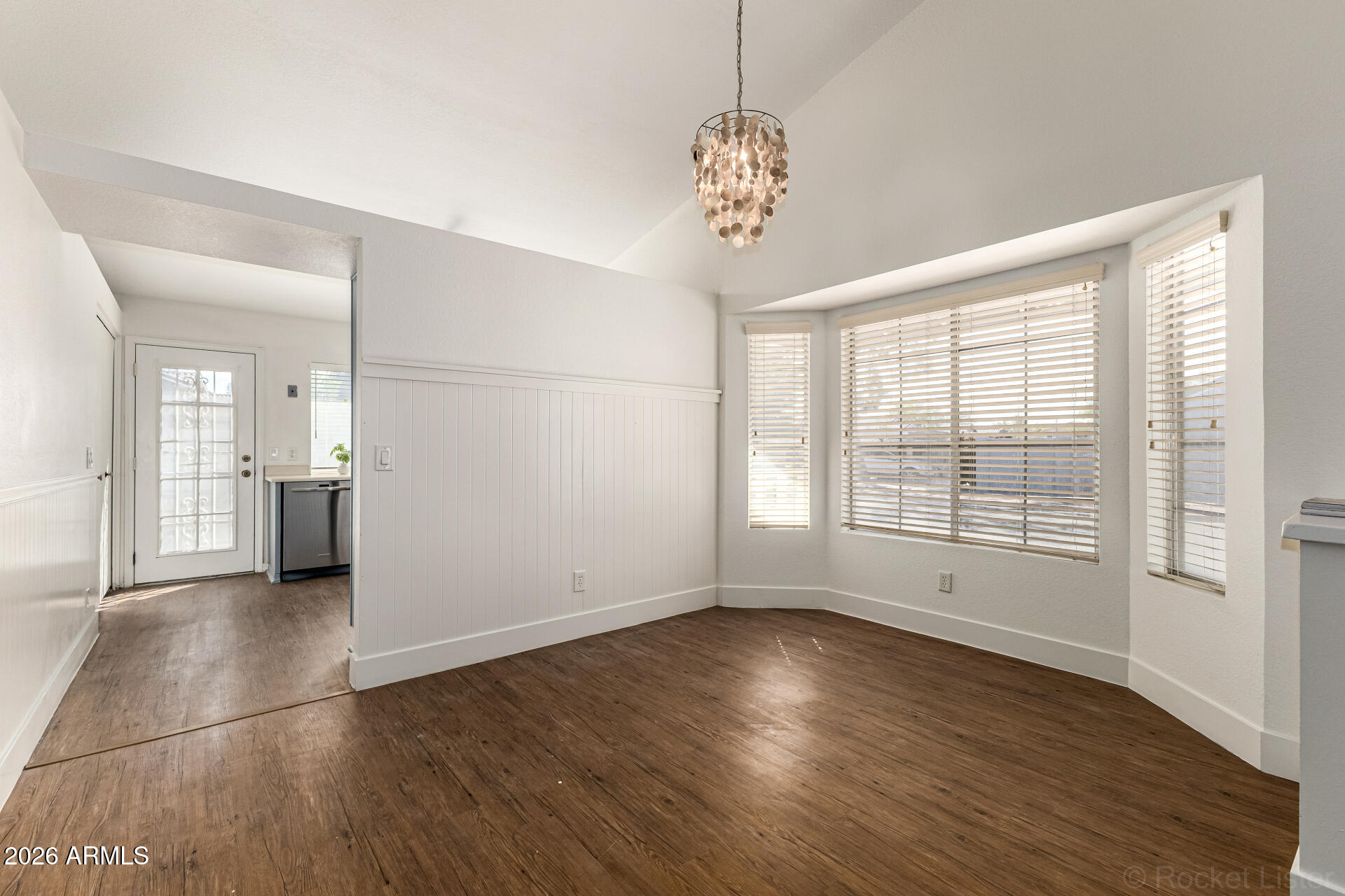 860 North McQueen Road, Unit 1092 Chandler, AZ 85225 - Photo 10 of 26 a view of empty room with wooden floor and fan