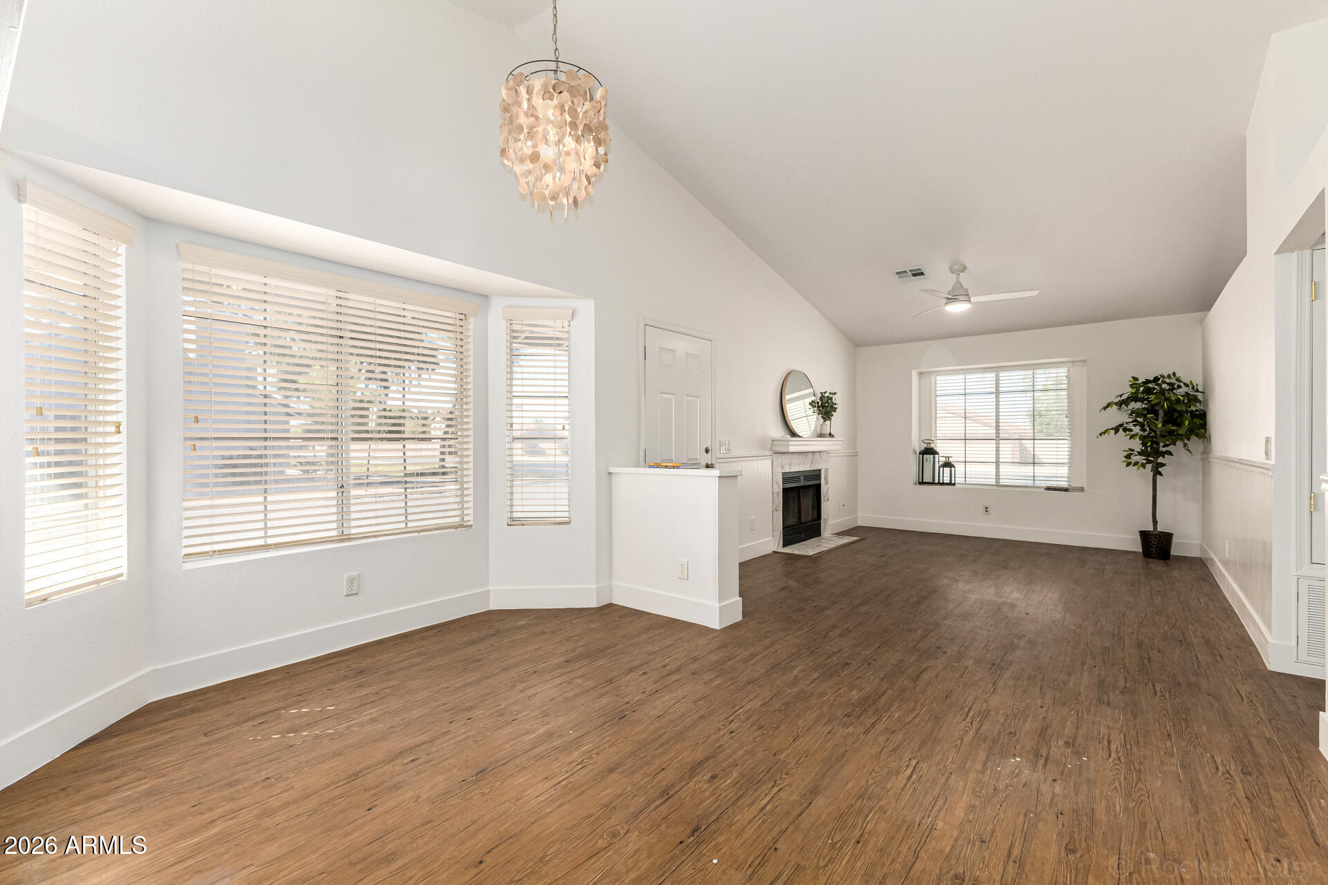 860 North McQueen Road, Unit 1092 Chandler, AZ 85225 - Photo 11 of 26 an empty room with wooden floor and windows