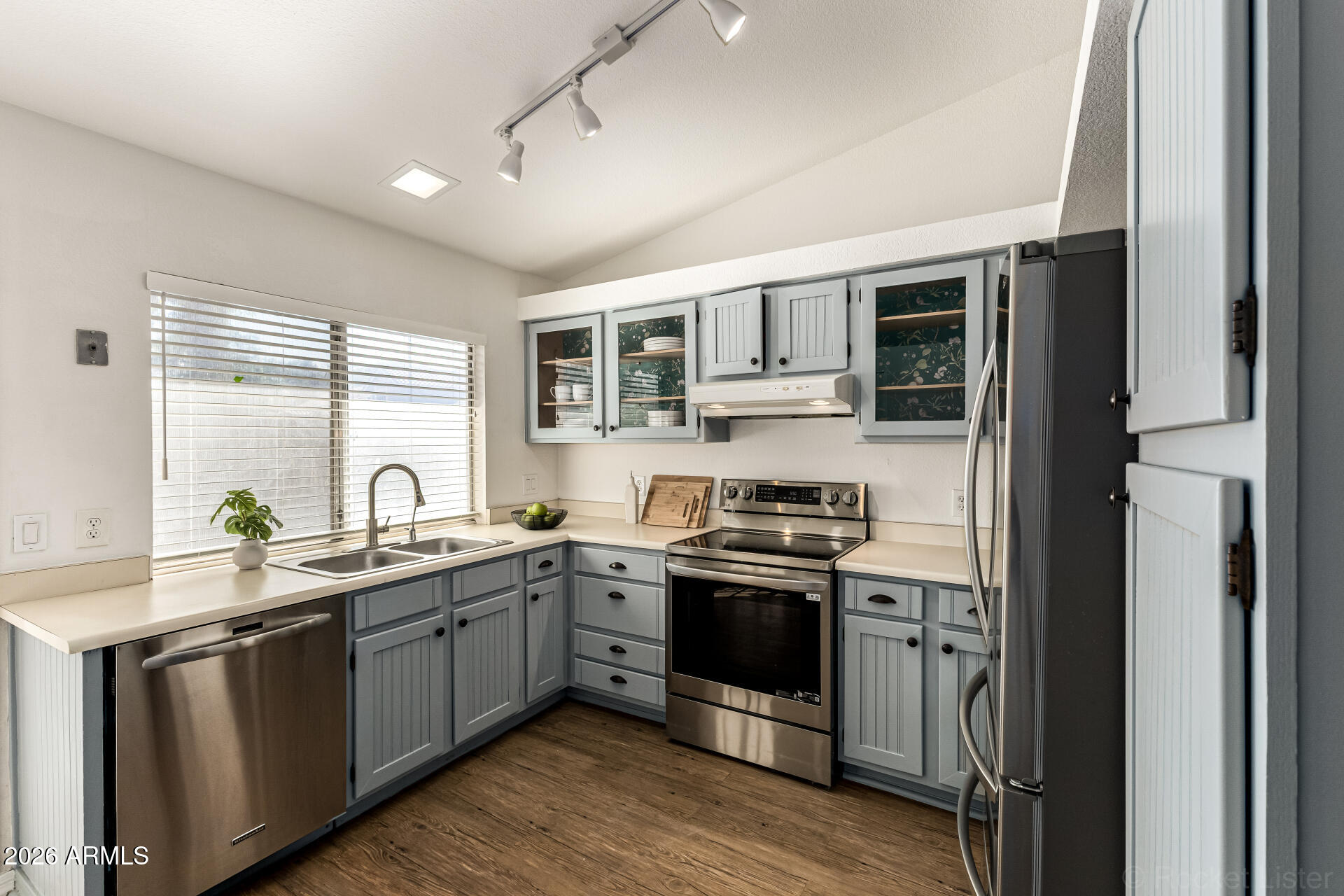 860 North McQueen Road, Unit 1092 Chandler, AZ 85225 - Photo 12 of 26 a kitchen with stainless steel appliances granite countertop a sink stove and refrigerator