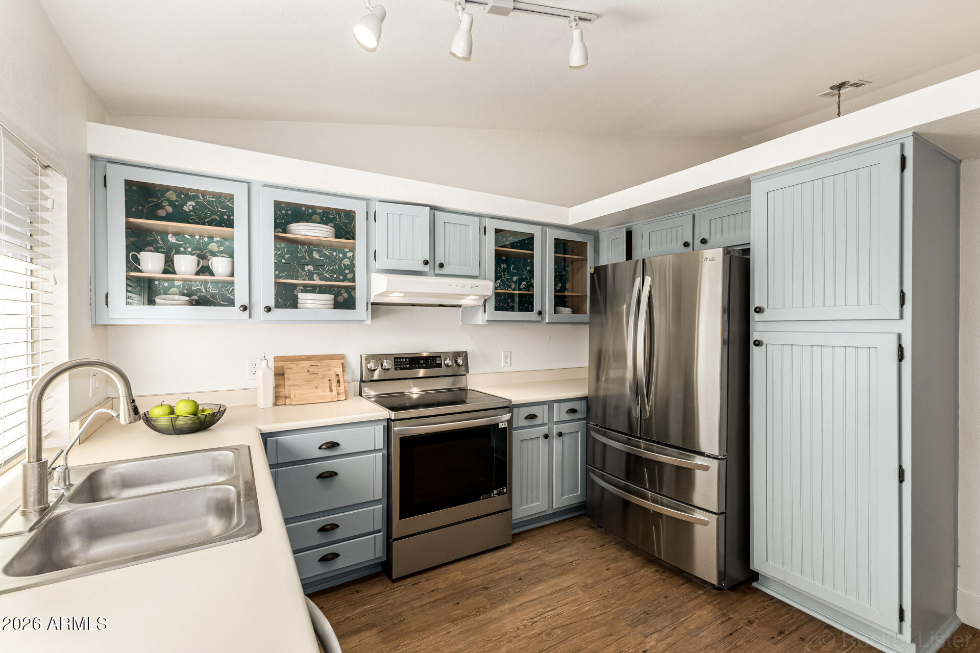 860 North McQueen Road, Unit 1092 Chandler, AZ 85225 - Photo 13 of 26 a kitchen with stainless steel appliances a stove a sink and a refrigerator