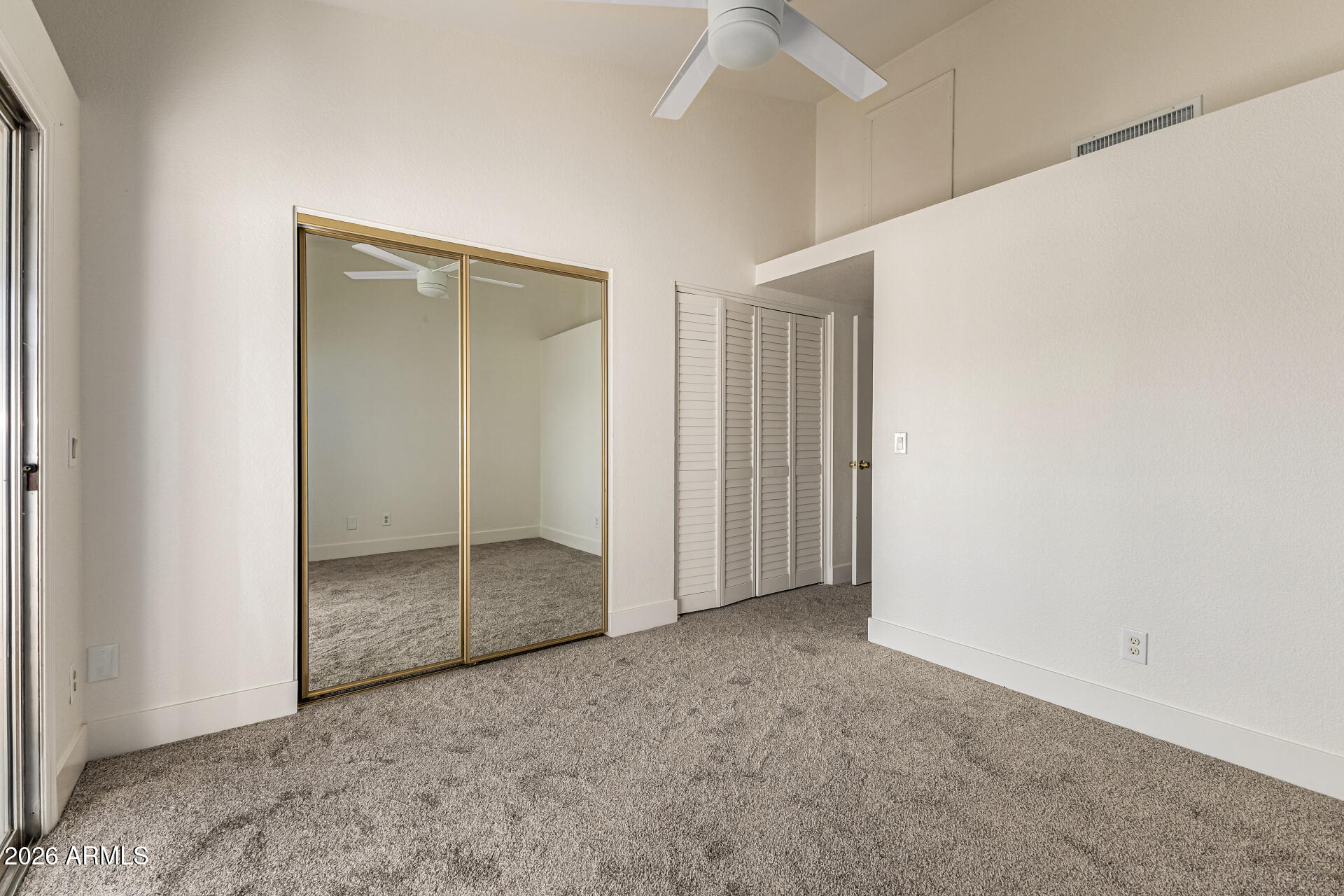 860 North McQueen Road, Unit 1092 Chandler, AZ 85225 - Photo 17 of 26 an empty room with closet and a bathroom