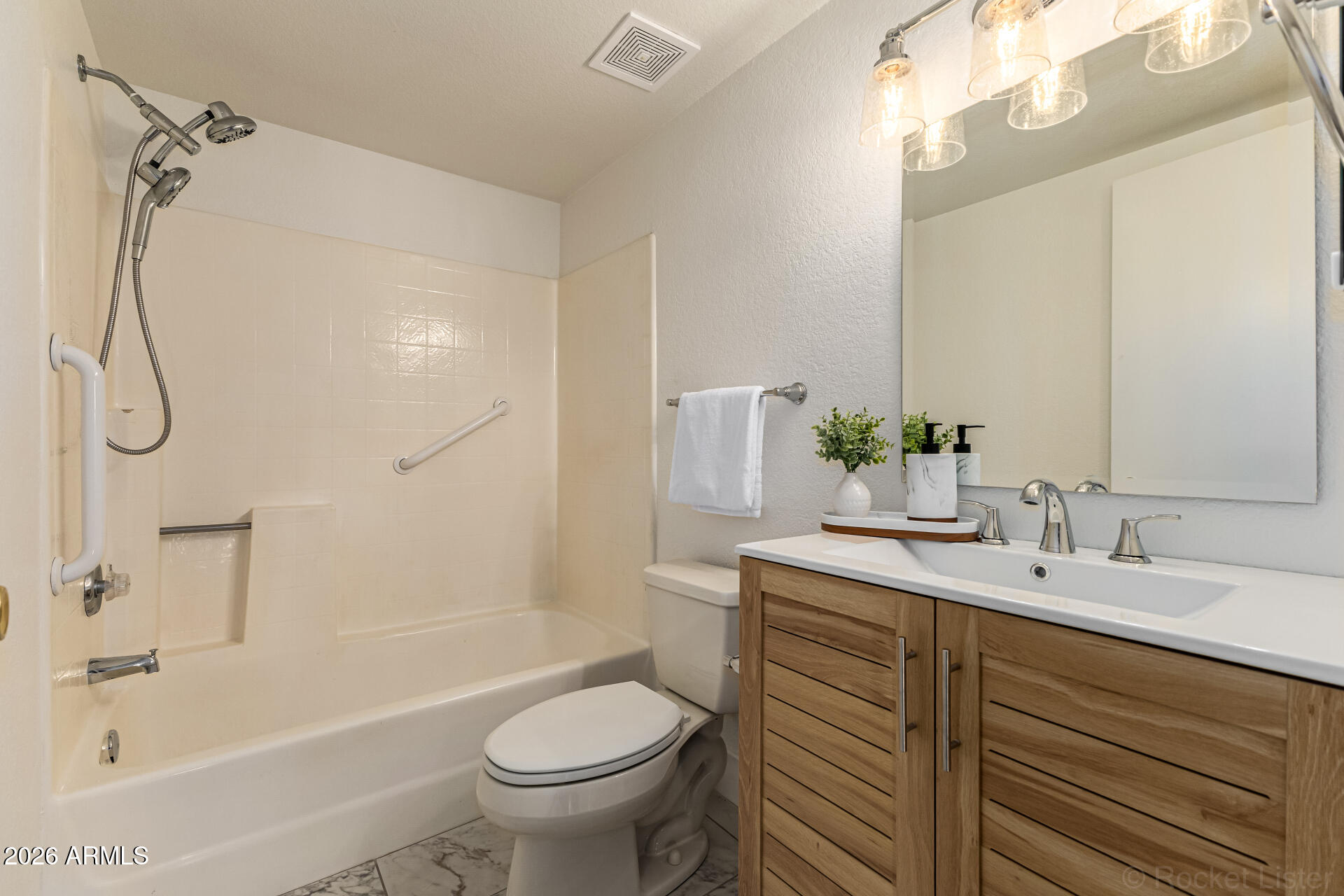 860 North McQueen Road, Unit 1092 Chandler, AZ 85225 - Photo 21 of 26 a bathroom with a sink a toilet and shower