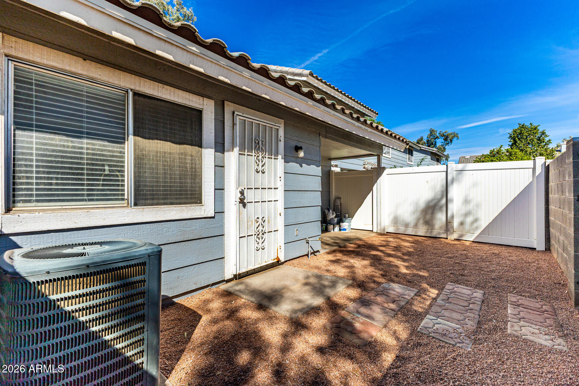 860 North McQueen Road, Unit 1092 Chandler, AZ 85225 - Photo 23 of 26 a view of a house with a backyard