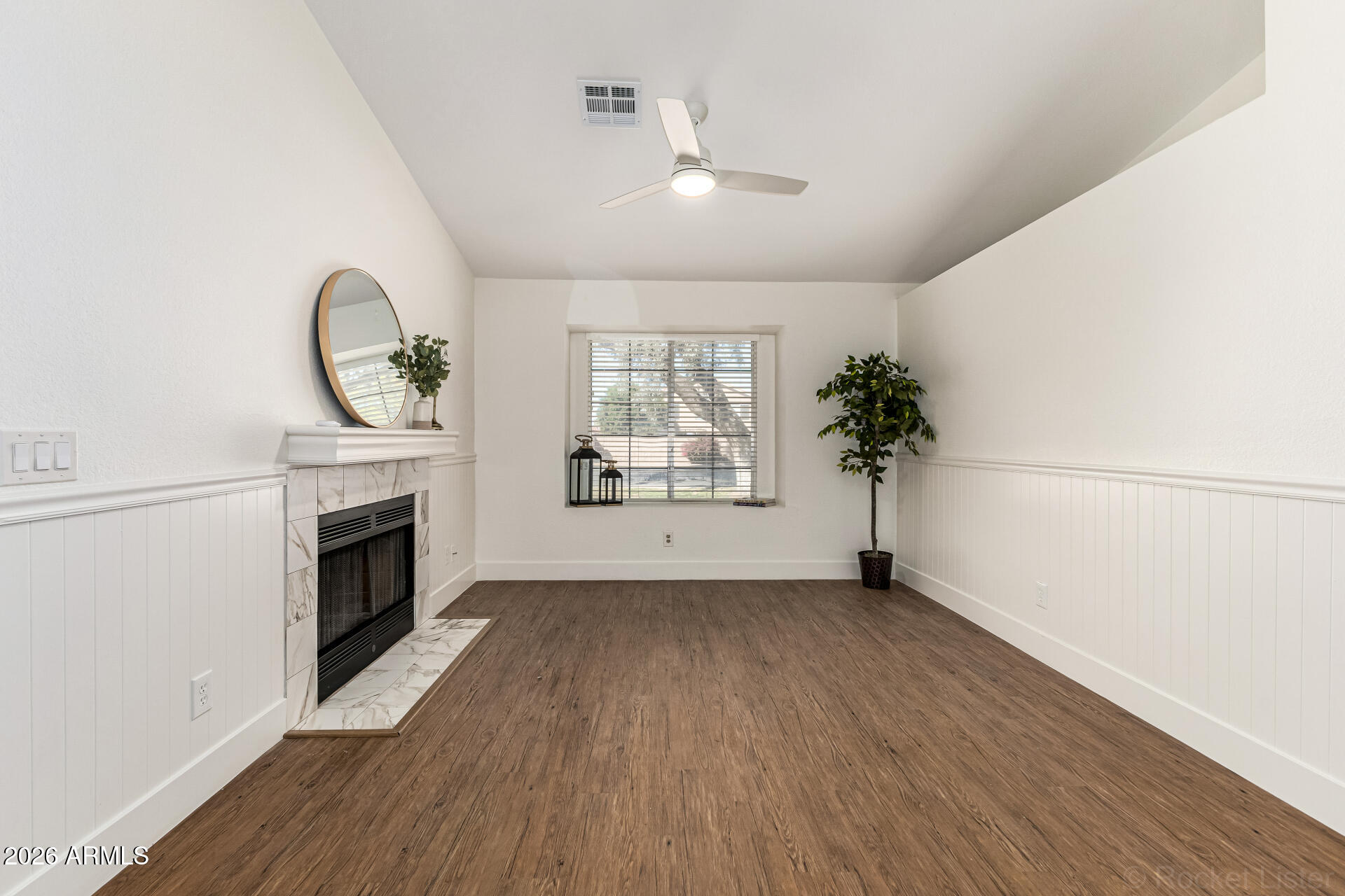 860 North McQueen Road, Unit 1092 Chandler, AZ 85225 - Photo 7 of 26 an empty room with wooden floor a fireplace and windows