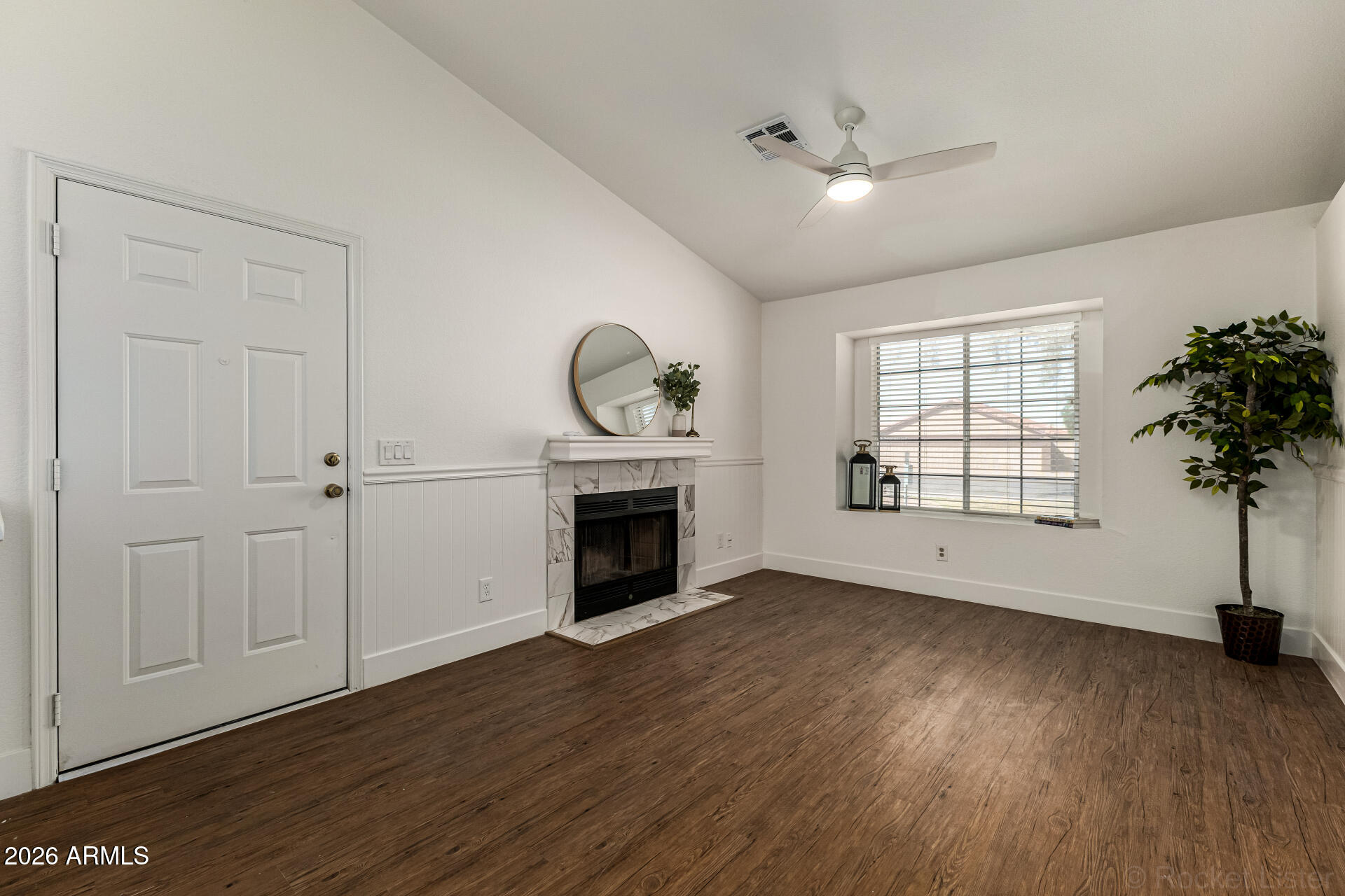 860 North McQueen Road, Unit 1092 Chandler, AZ 85225 - Photo 8 of 26 an empty room with windows and a fireplace