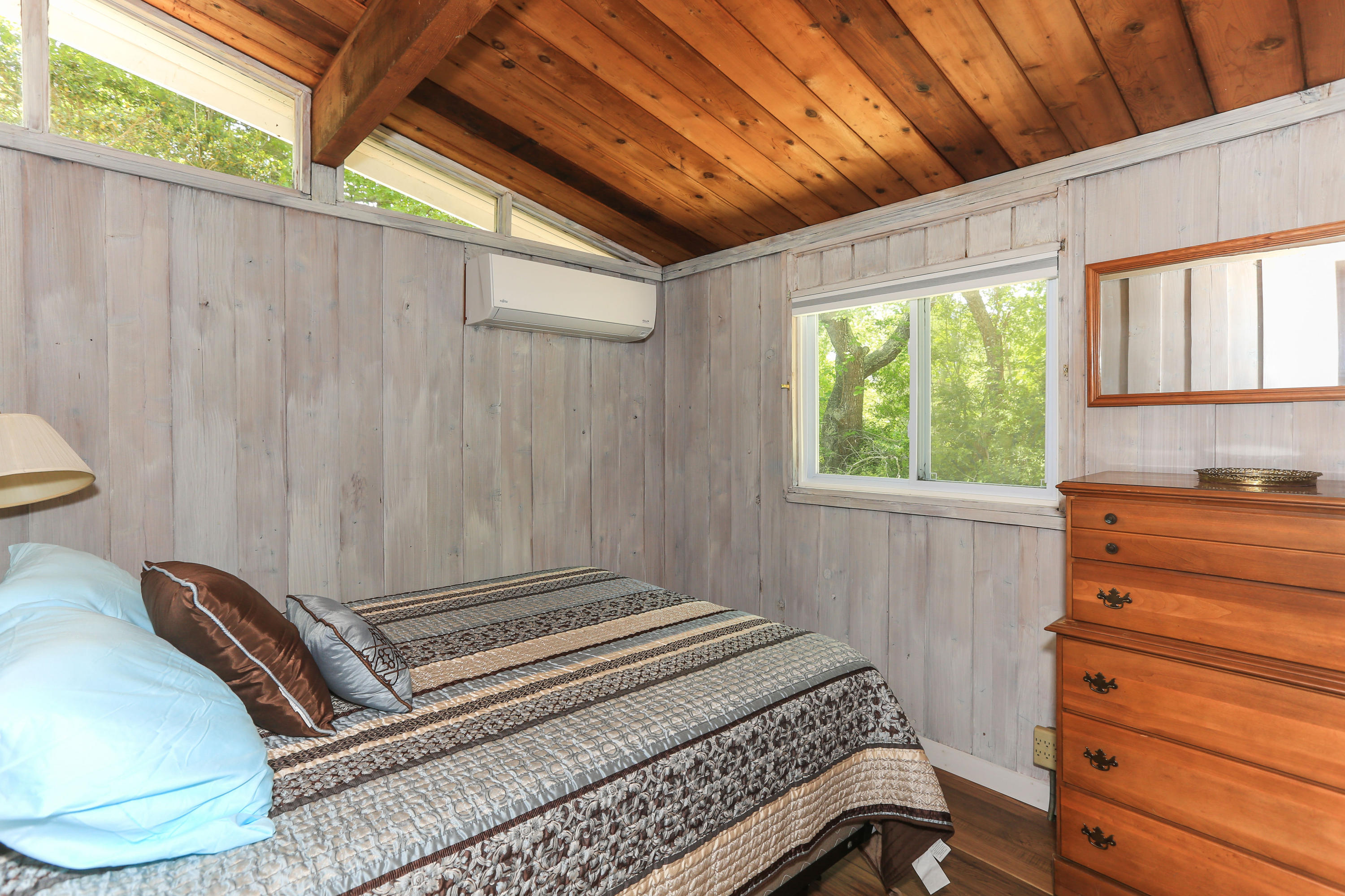 38 Lakeside Drive Marstons Mills, MA 02648 - Photo 11 of 21 a bedroom with a bed and a window