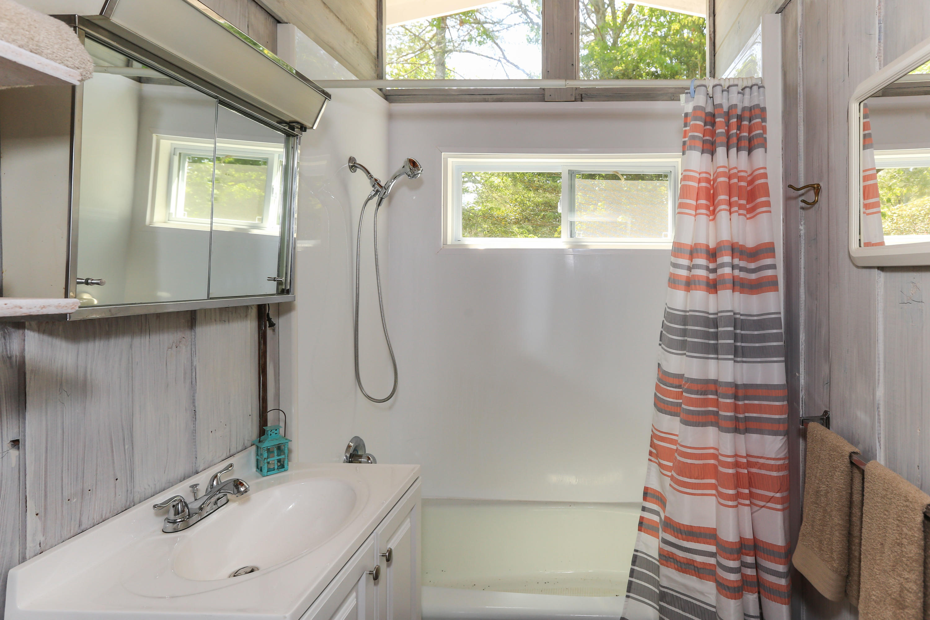 38 Lakeside Drive Marstons Mills, MA 02648 - Photo 16 of 21 a bathroom with a sink a mirror and a shower