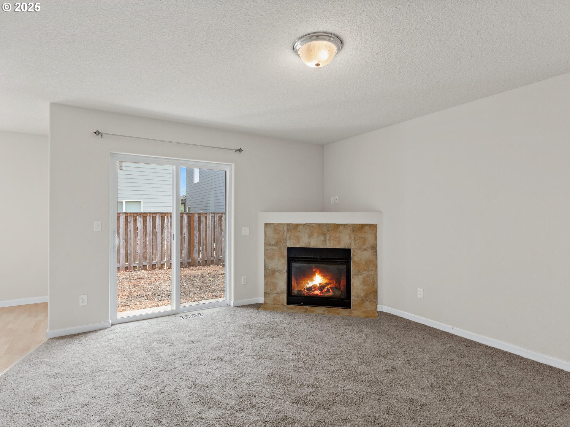 2709 Fletch Street Forest Grove, OR 97116 - Photo 12 of 44 a view of an empty room with a fireplace