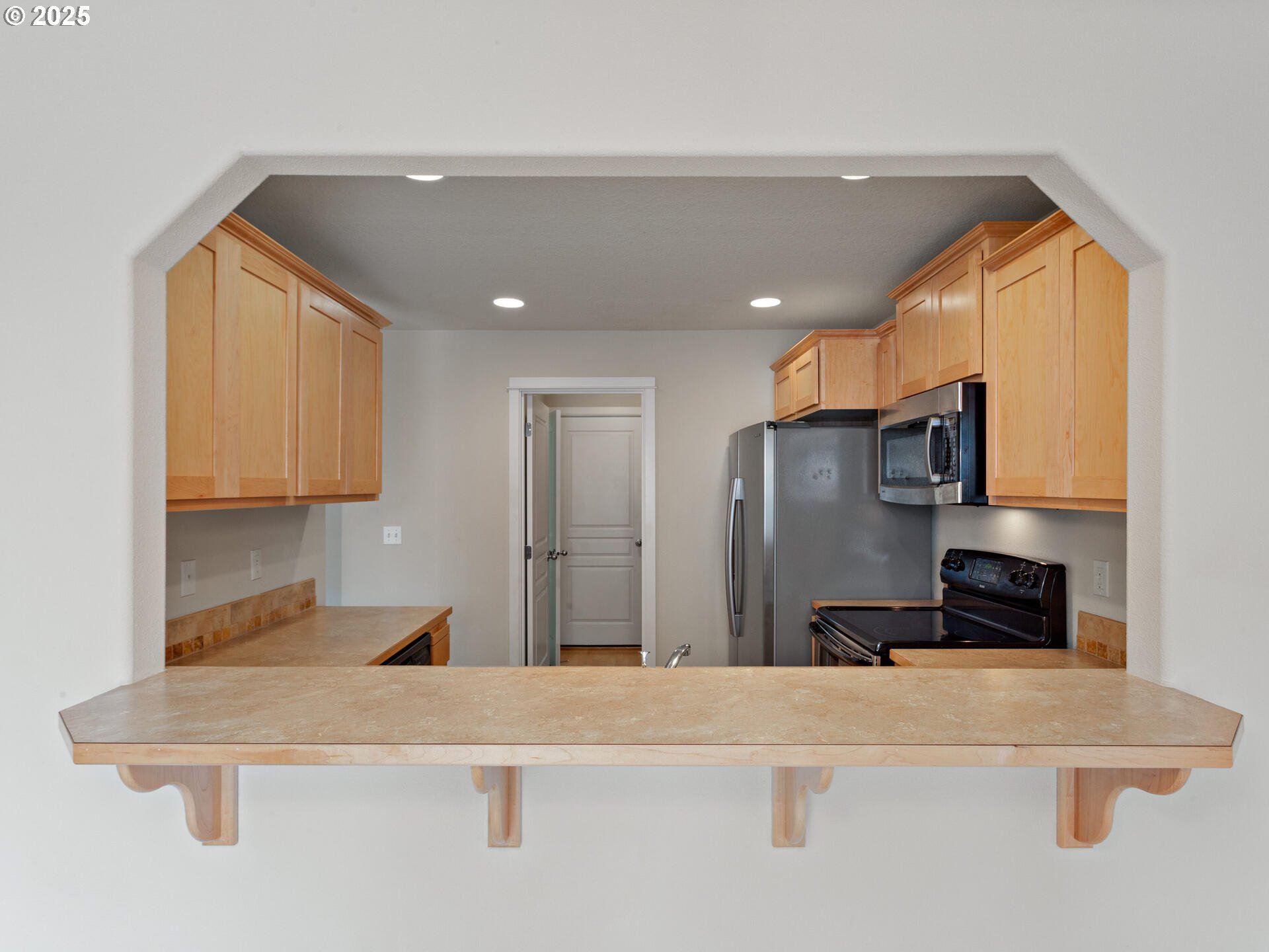 2709 Fletch Street Forest Grove, OR 97116 - Photo 16 of 44 a kitchen with stainless steel appliances granite countertop a refrigerator a stove and a sink with wooden floor