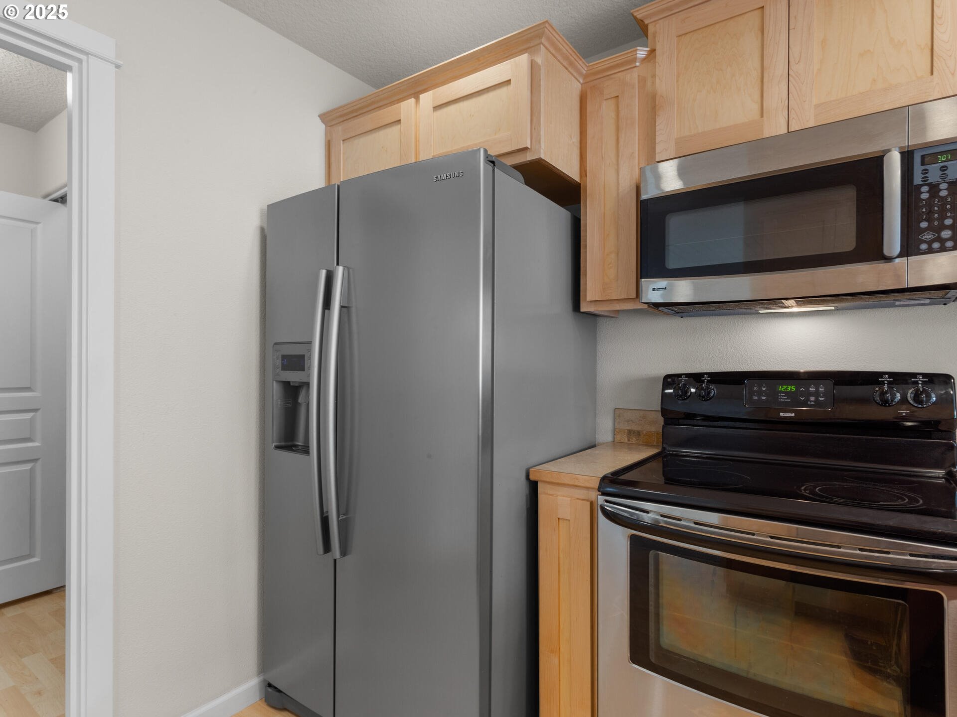 2709 Fletch Street Forest Grove, OR 97116 - Photo 20 of 44 a kitchen with a stove microwave and refrigerator