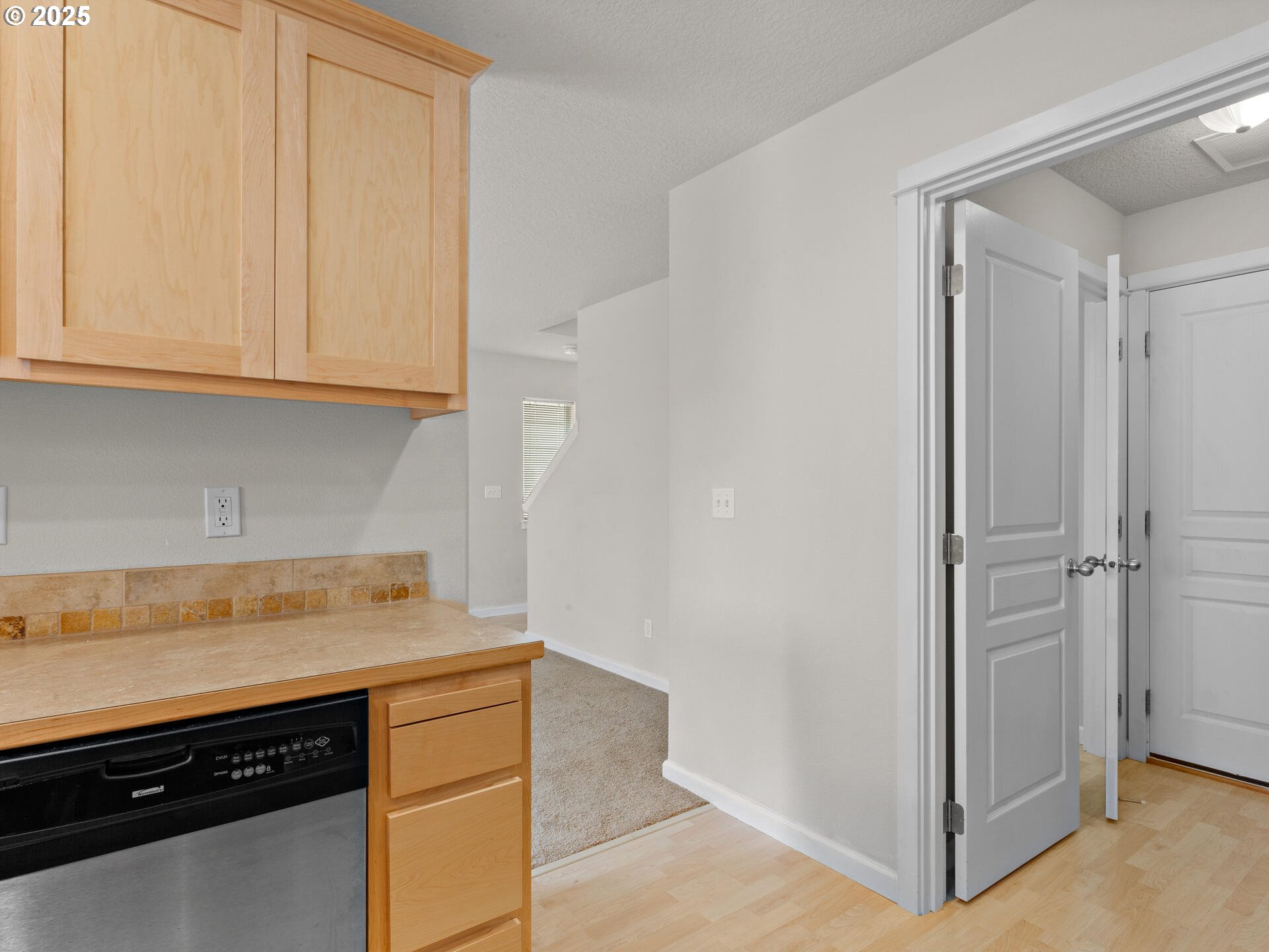 2709 Fletch Street Forest Grove, OR 97116 - Photo 22 of 44 a view of a kitchen with white cabinets