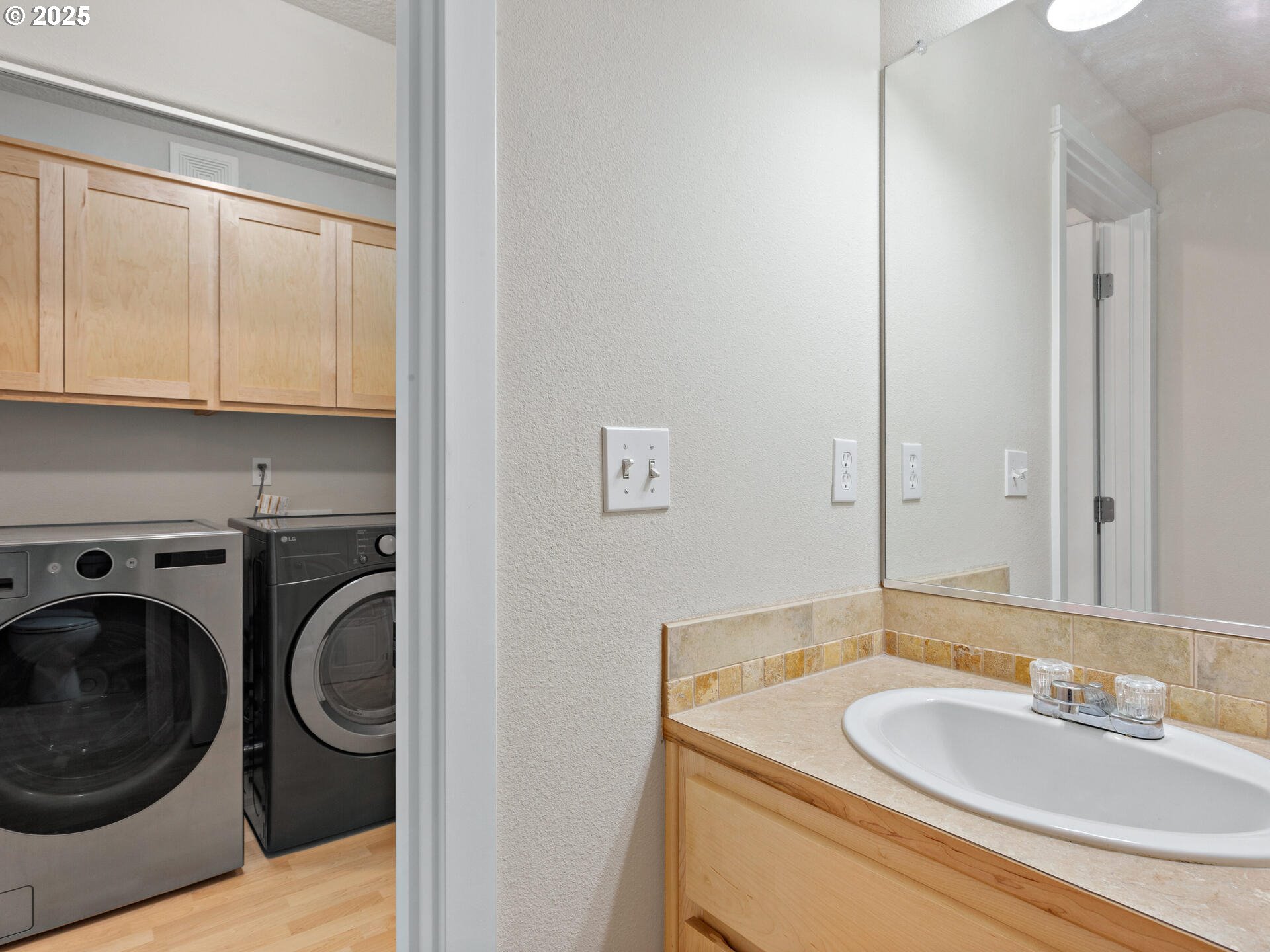 2709 Fletch Street Forest Grove, OR 97116 - Photo 24 of 44 a en suite bathroom with a sink a washer and dryer