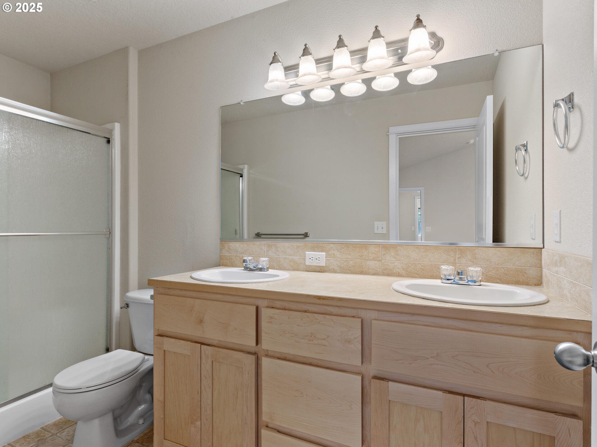 2709 Fletch Street Forest Grove, OR 97116 - Photo 30 of 44 a bathroom with a sink vanity mirror and toilet