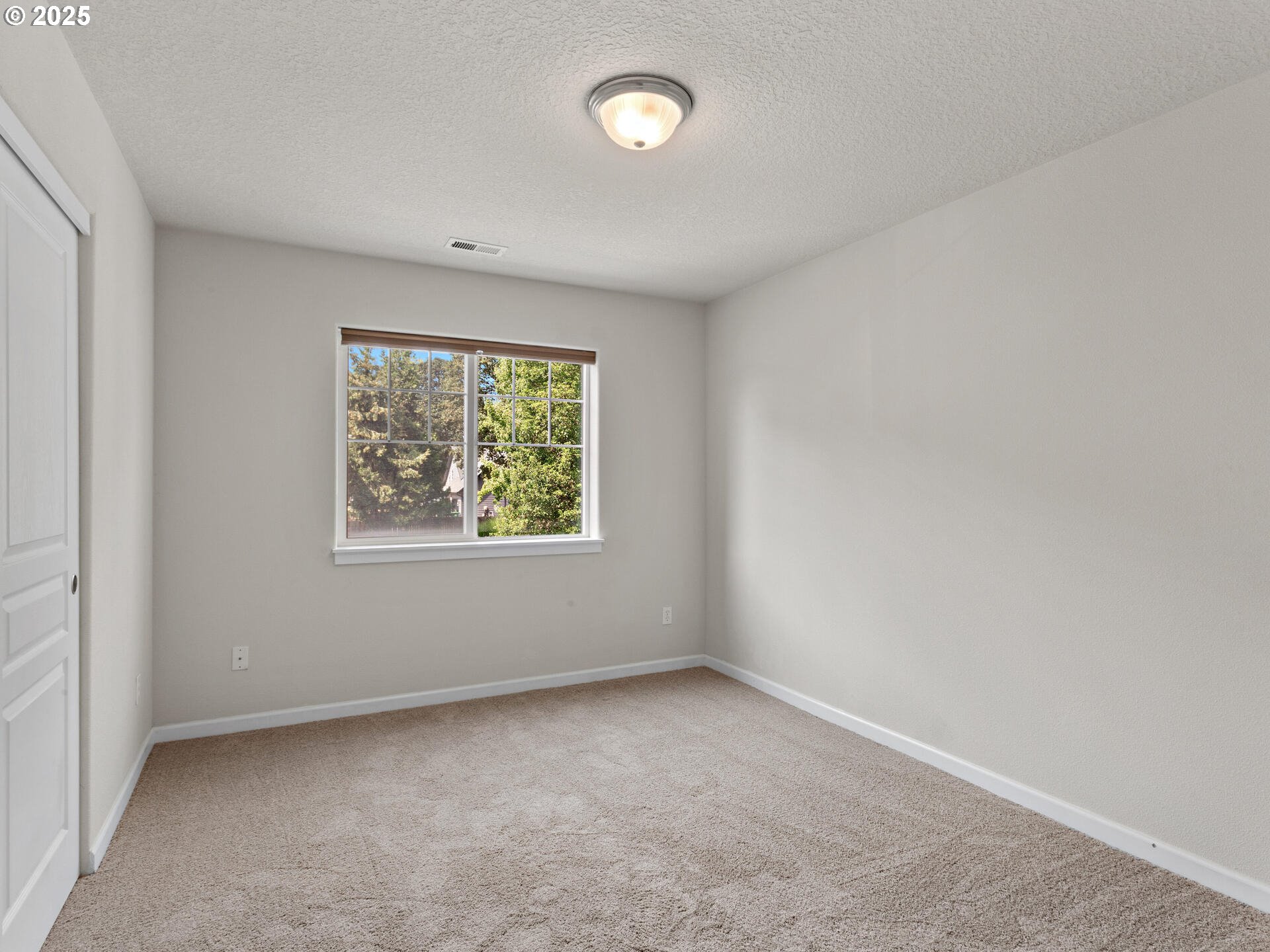 2709 Fletch Street Forest Grove, OR 97116 - Photo 32 of 44 an empty room with a window