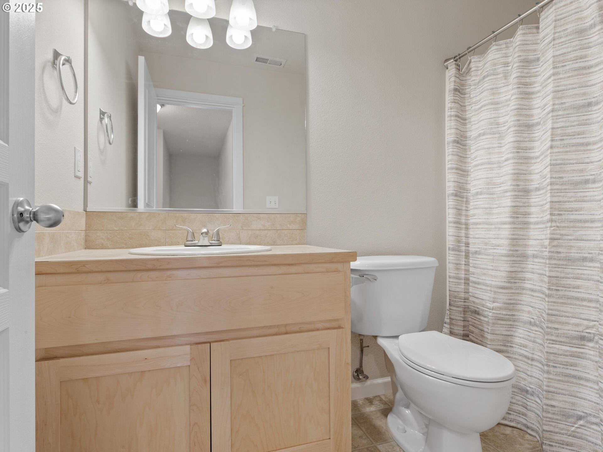 2709 Fletch Street Forest Grove, OR 97116 - Photo 36 of 44 a bathroom with a sink mirror vanity and toilet