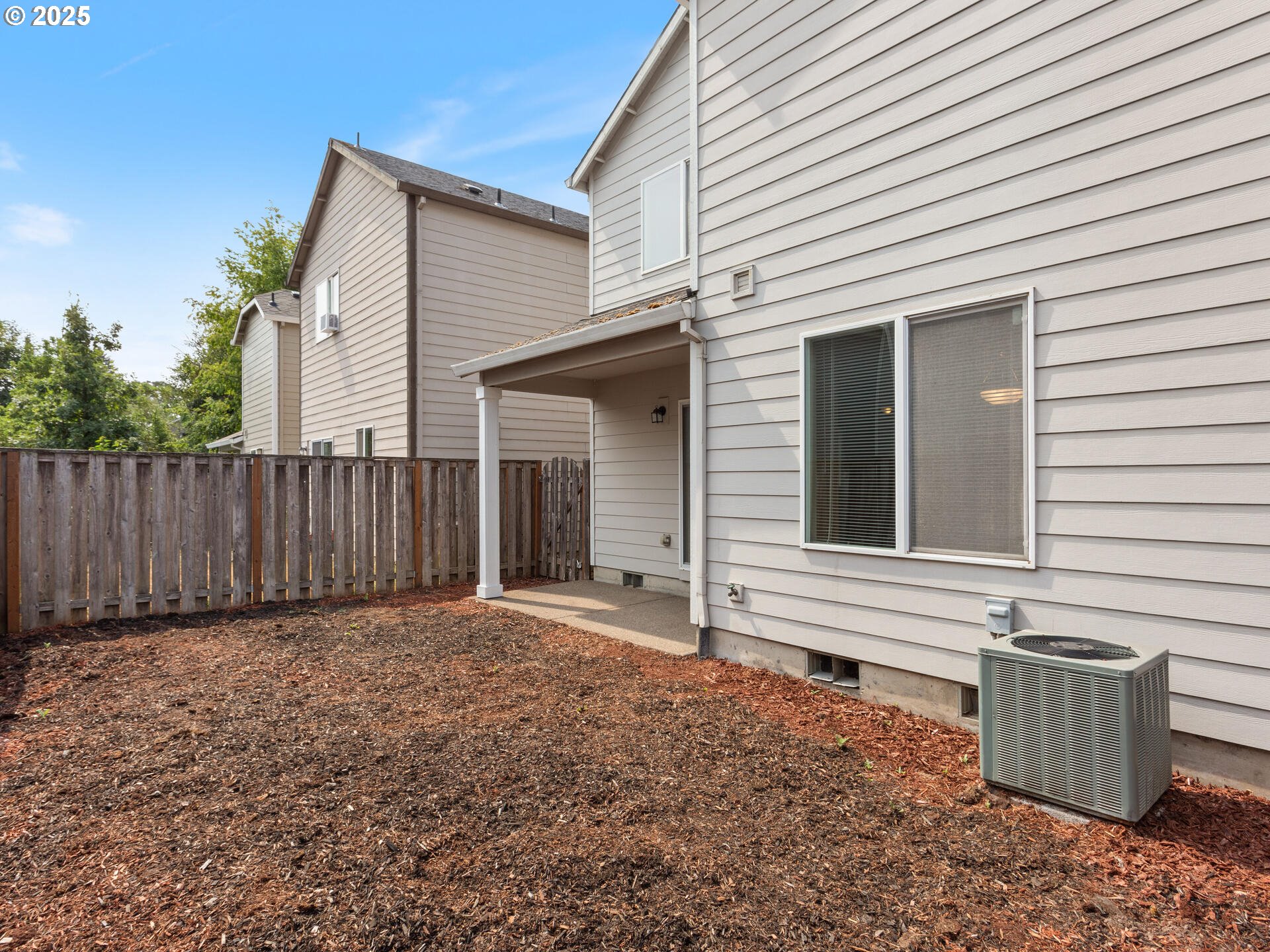 2709 Fletch Street Forest Grove, OR 97116 - Photo 41 of 44 a view of a backyard with wooden fence