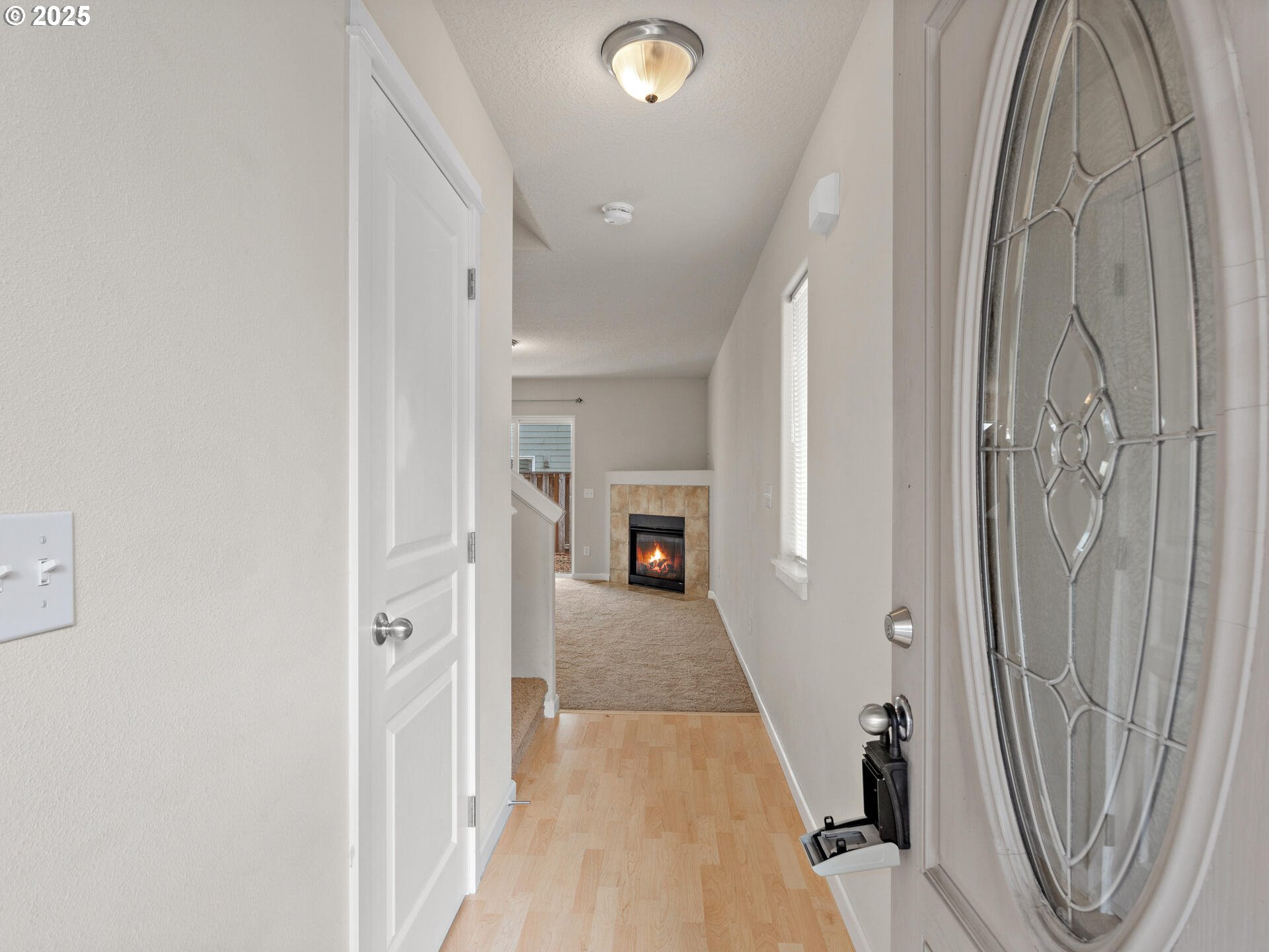 2709 Fletch Street Forest Grove, OR 97116 - Photo 7 of 44 a view of a hallway with wooden floor and staircase