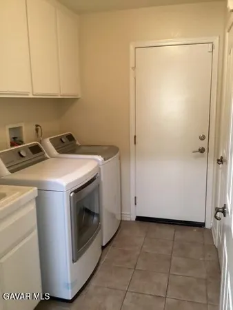 a utility room with washer and dryer