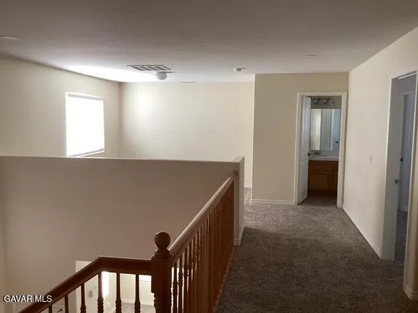 a view of an empty room with windows