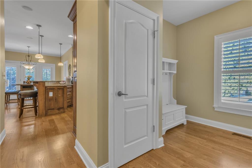 1611 Silvergrass Lane Grayson, GA 30017 - Photo 12 of 90 a view of kitchen with furniture and wooden floor