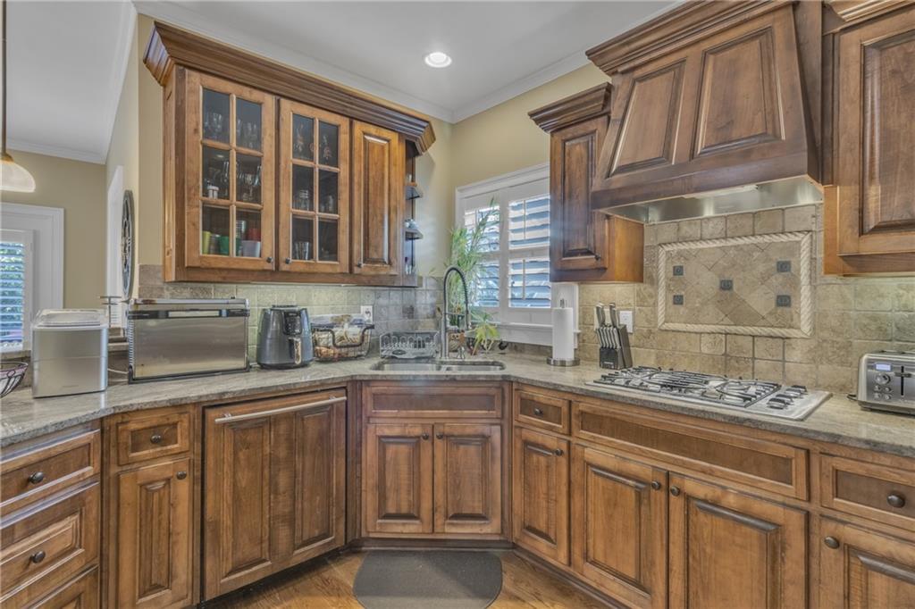 1611 Silvergrass Lane Grayson, GA 30017 - Photo 14 of 90 a kitchen with stainless steel appliances granite countertop a sink and cabinets