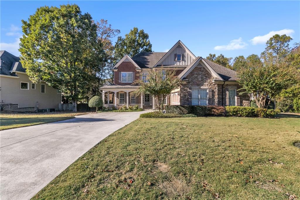 1611 Silvergrass Lane Grayson, GA 30017 - Photo 3 of 90 a front view of a house with a yard