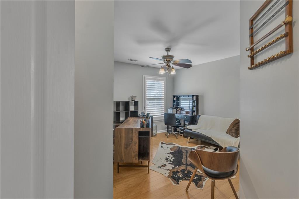 1611 Silvergrass Lane Grayson, GA 30017 - Photo 53 of 90 a view of a workspace with furniture and a window