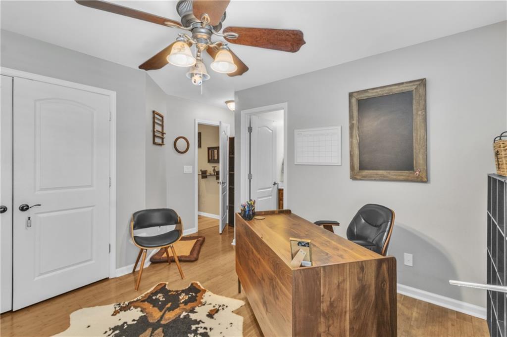 1611 Silvergrass Lane Grayson, GA 30017 - Photo 55 of 90 a living room with furniture and a chandelier