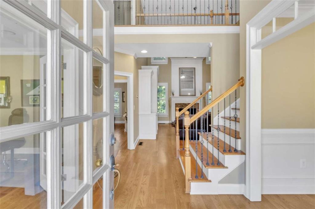 1611 Silvergrass Lane Grayson, GA 30017 - Photo 6 of 90 a view of staircase with lots of frames on wall and a large window