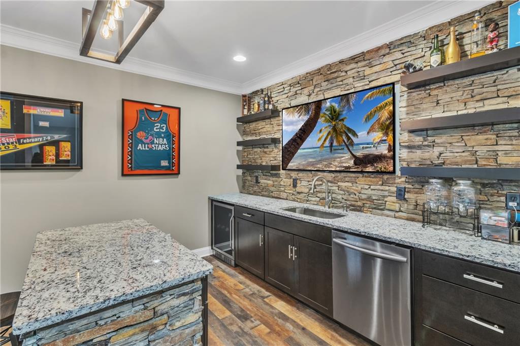 1611 Silvergrass Lane Grayson, GA 30017 - Photo 64 of 90 a kitchen with stainless steel appliances granite countertop a stove and a sink