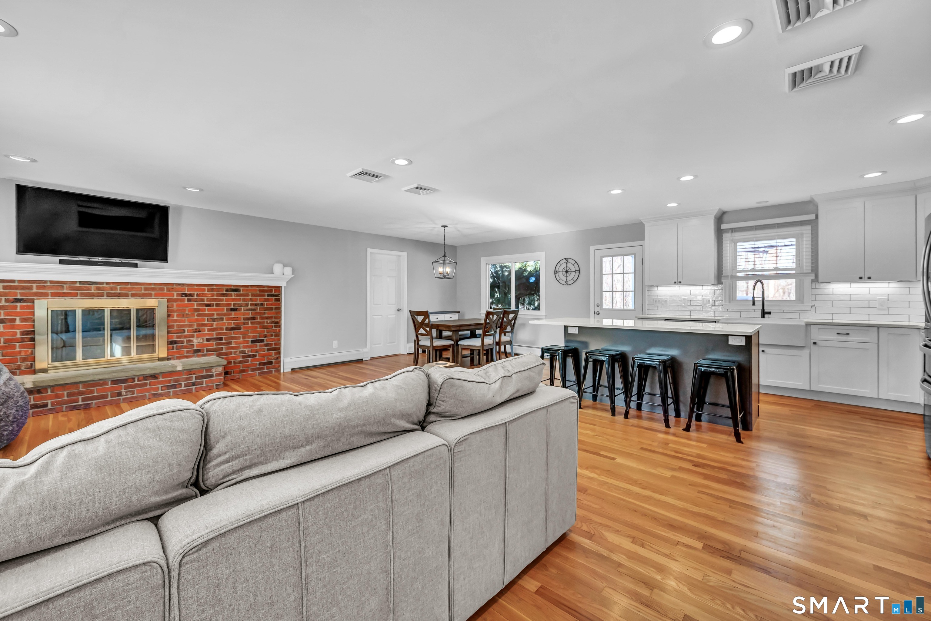 23 Federal Road Shelton, CT 06484 - Photo 4 of 39 Living room with view to kitchen and dinning room.