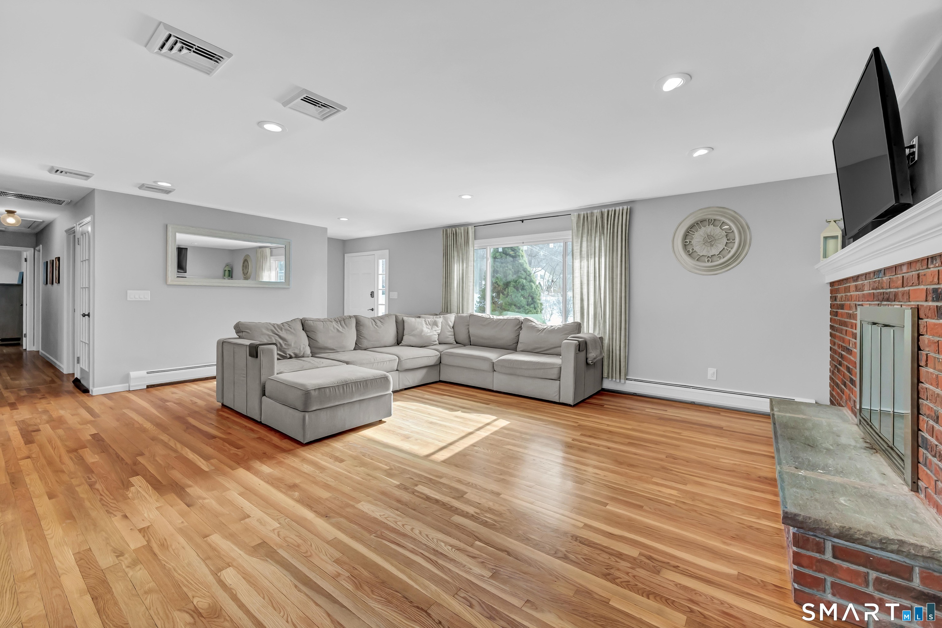 23 Federal Road Shelton, CT 06484 - Photo 6 of 39 View of living room with front door and hallway