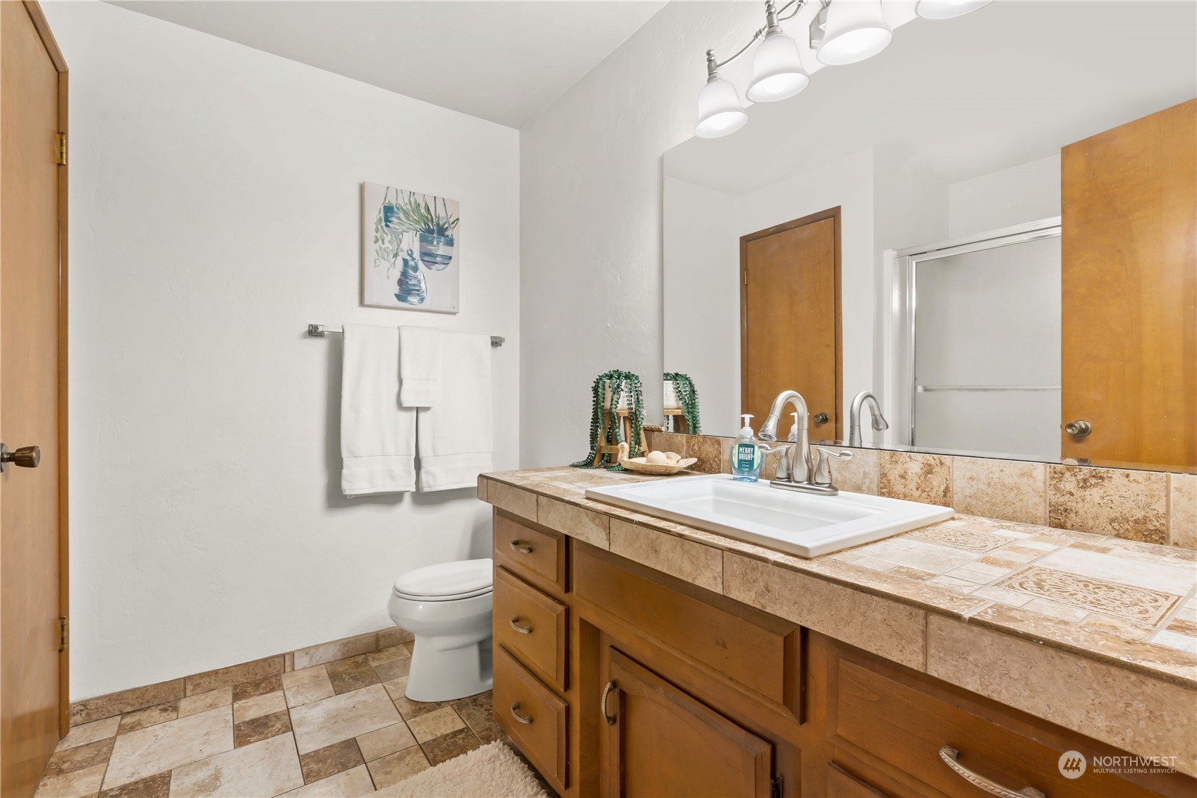 174 Frogner Road Chehalis, WA 98532 - Photo 17 of 40 a bathroom with a granite countertop sink and a mirror