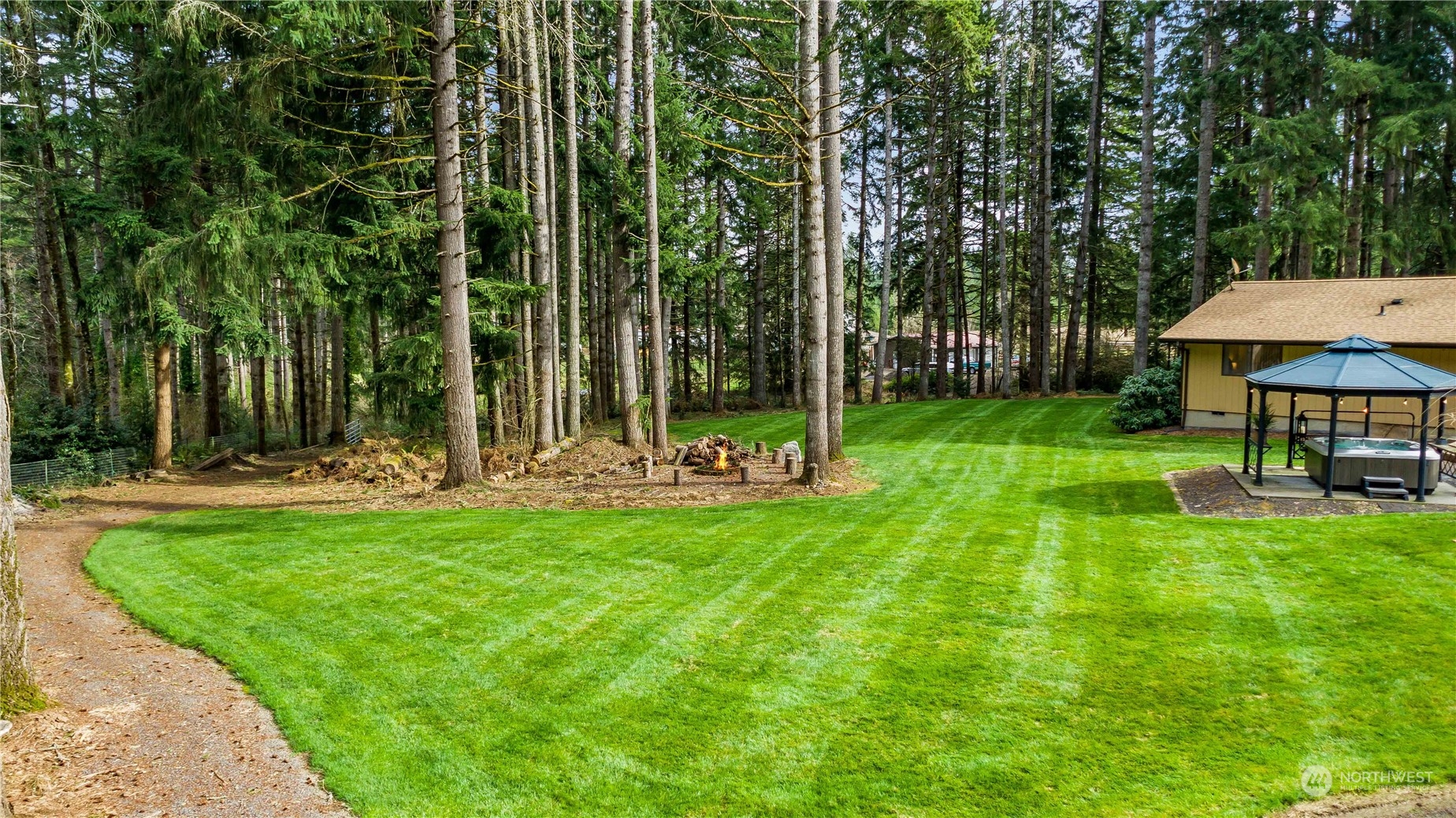 174 Frogner Road Chehalis, WA 98532 - Photo 22 of 40 a view of backyard with a garden and trees