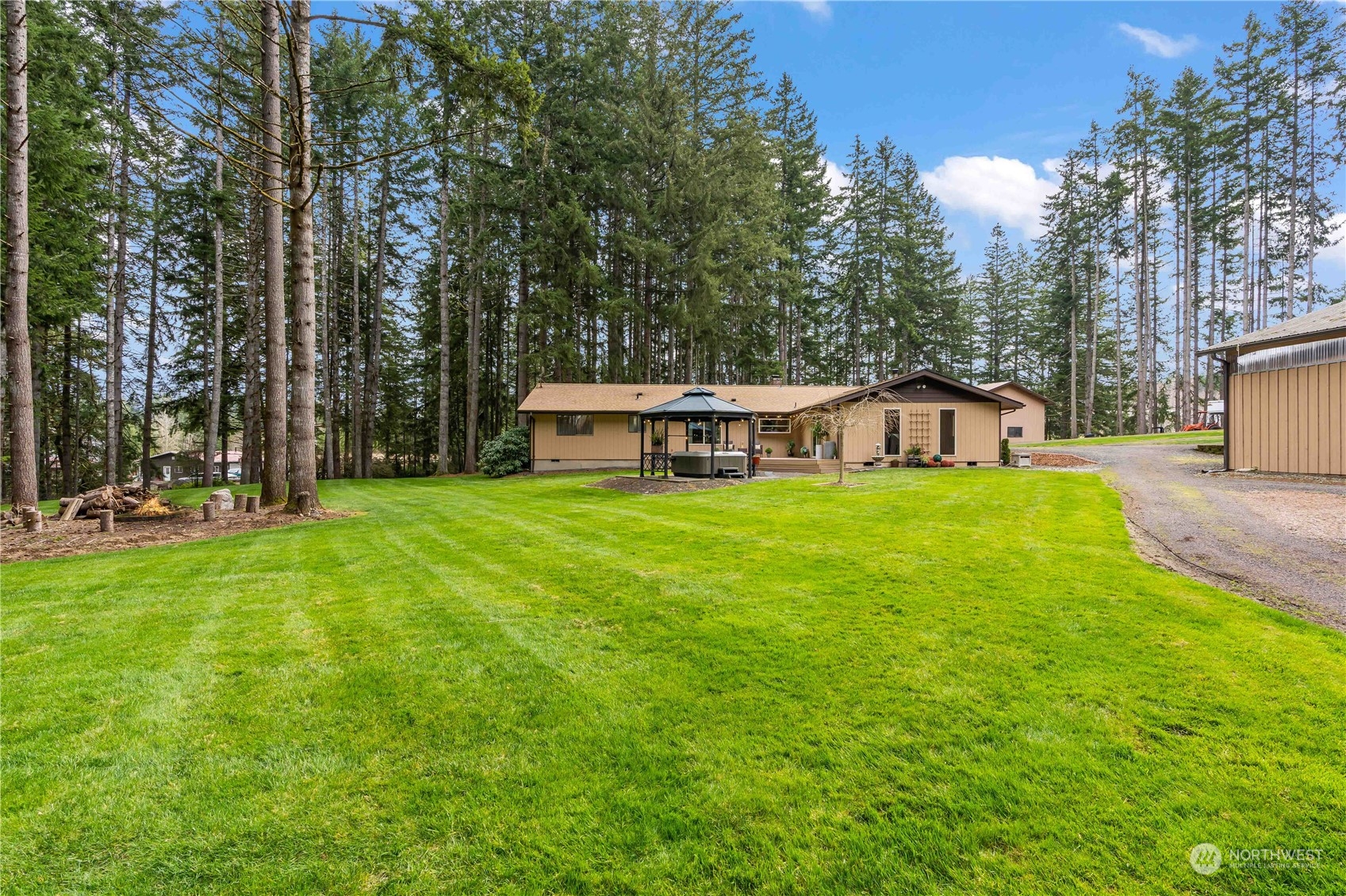 174 Frogner Road Chehalis, WA 98532 - Photo 23 of 40 a view of a house with a big yard and large trees