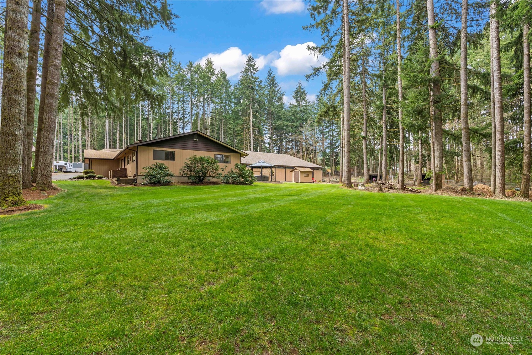 174 Frogner Road Chehalis, WA 98532 - Photo 25 of 40 a view of a house with a big yard and large trees