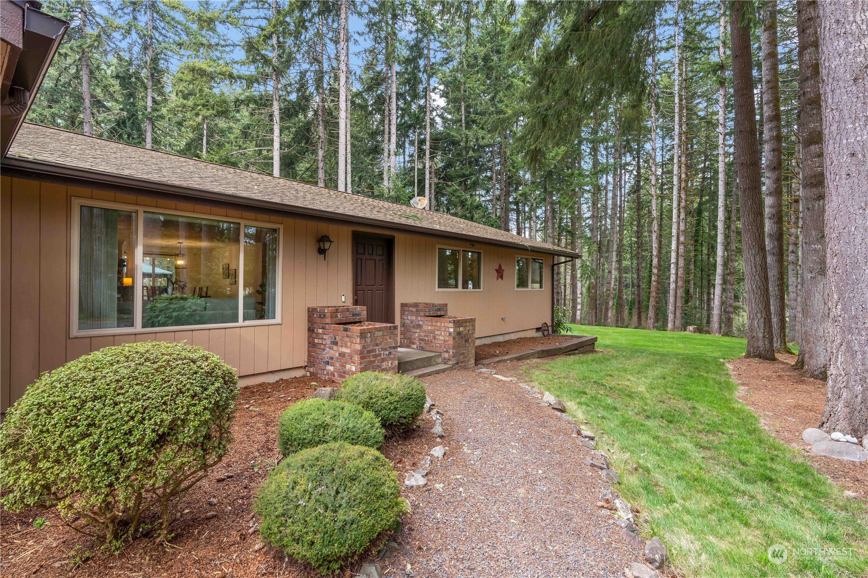 174 Frogner Road Chehalis, WA 98532 - Photo 4 of 40 a front view of a house with garden and porch