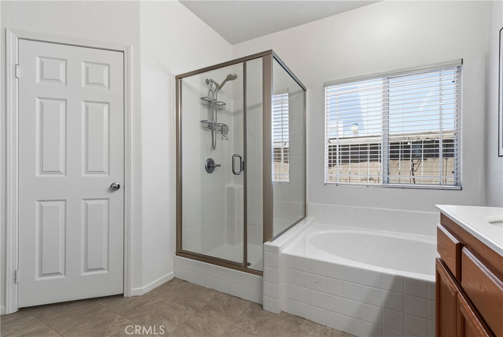 33145 Vermont Road Temecula, CA 92592 - Photo 24 of 41 a bathroom with a bathtub and a shower