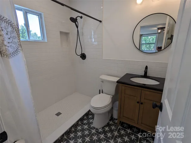 a bathroom with a toilet a sink and bathtub