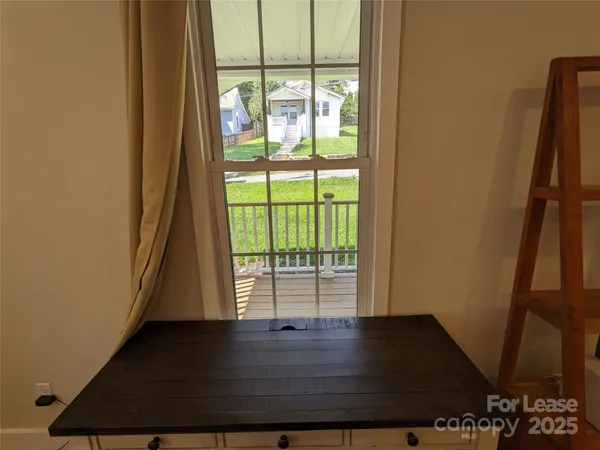 a view of front door with wooden floor
