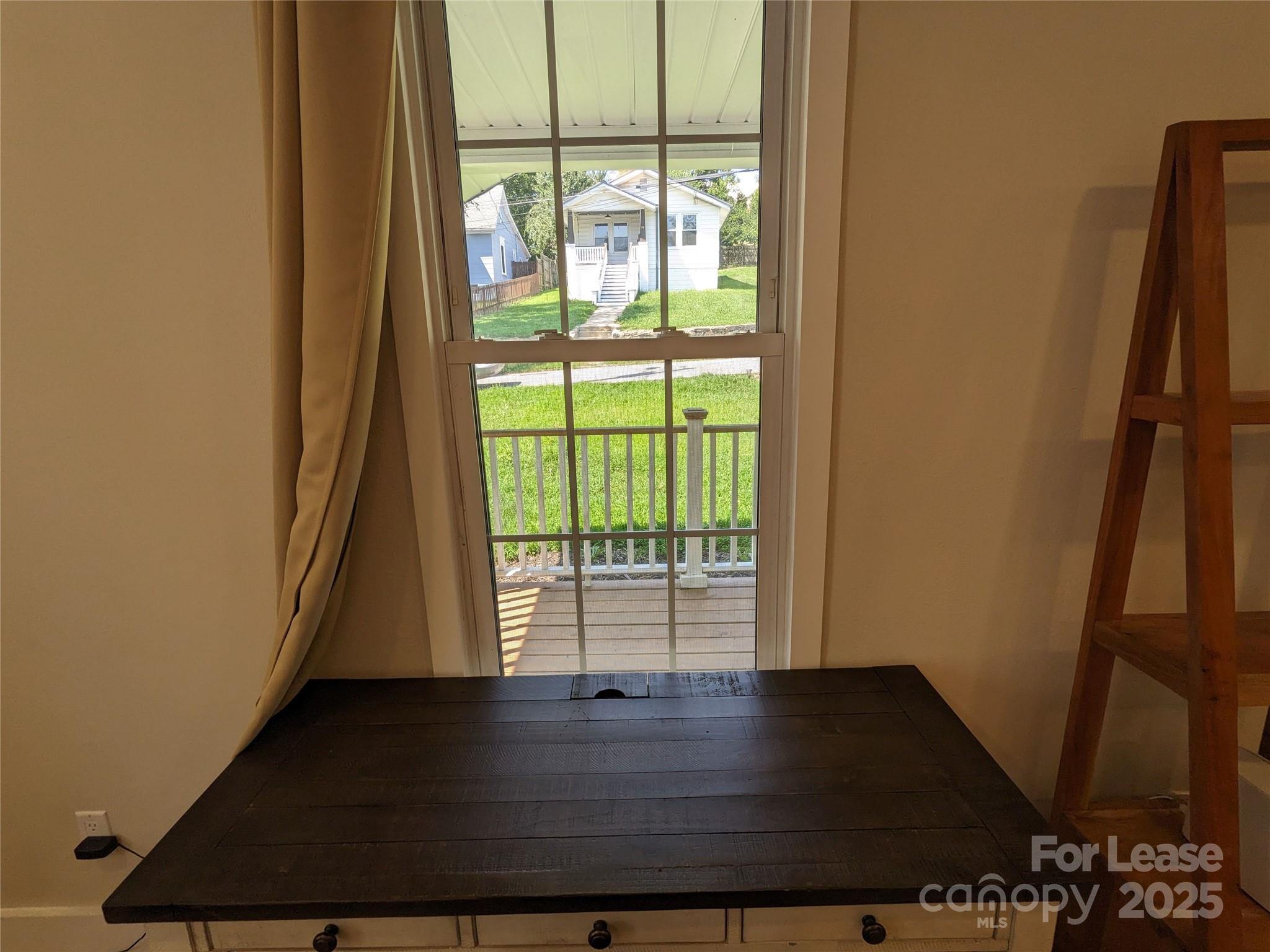 29 Woodrow Avenue, Unit 1 Asheville, NC 28801 - Photo 18 of 23 a view of front door with wooden floor