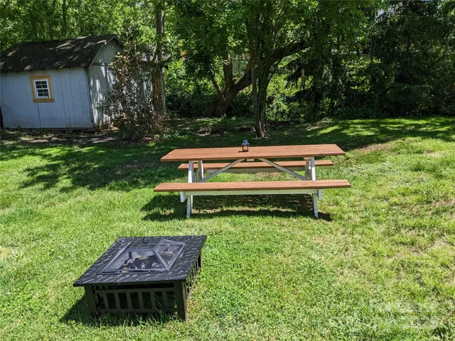a view of a garden with a bench