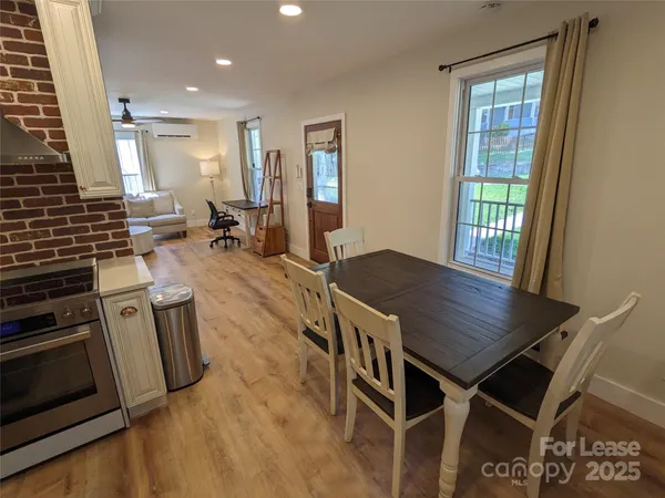a open kitchen with sink table and chairs