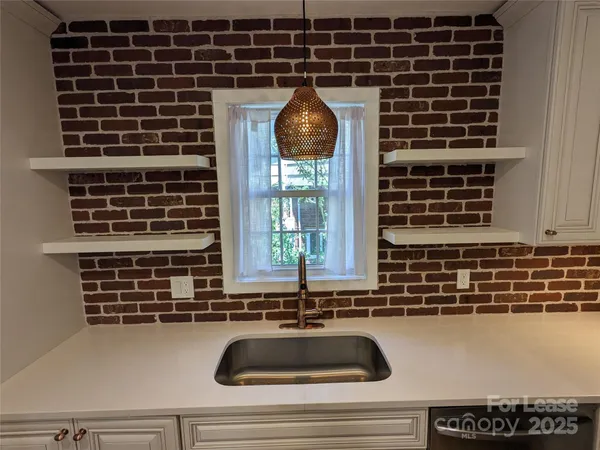 a kitchen with a sink and a window