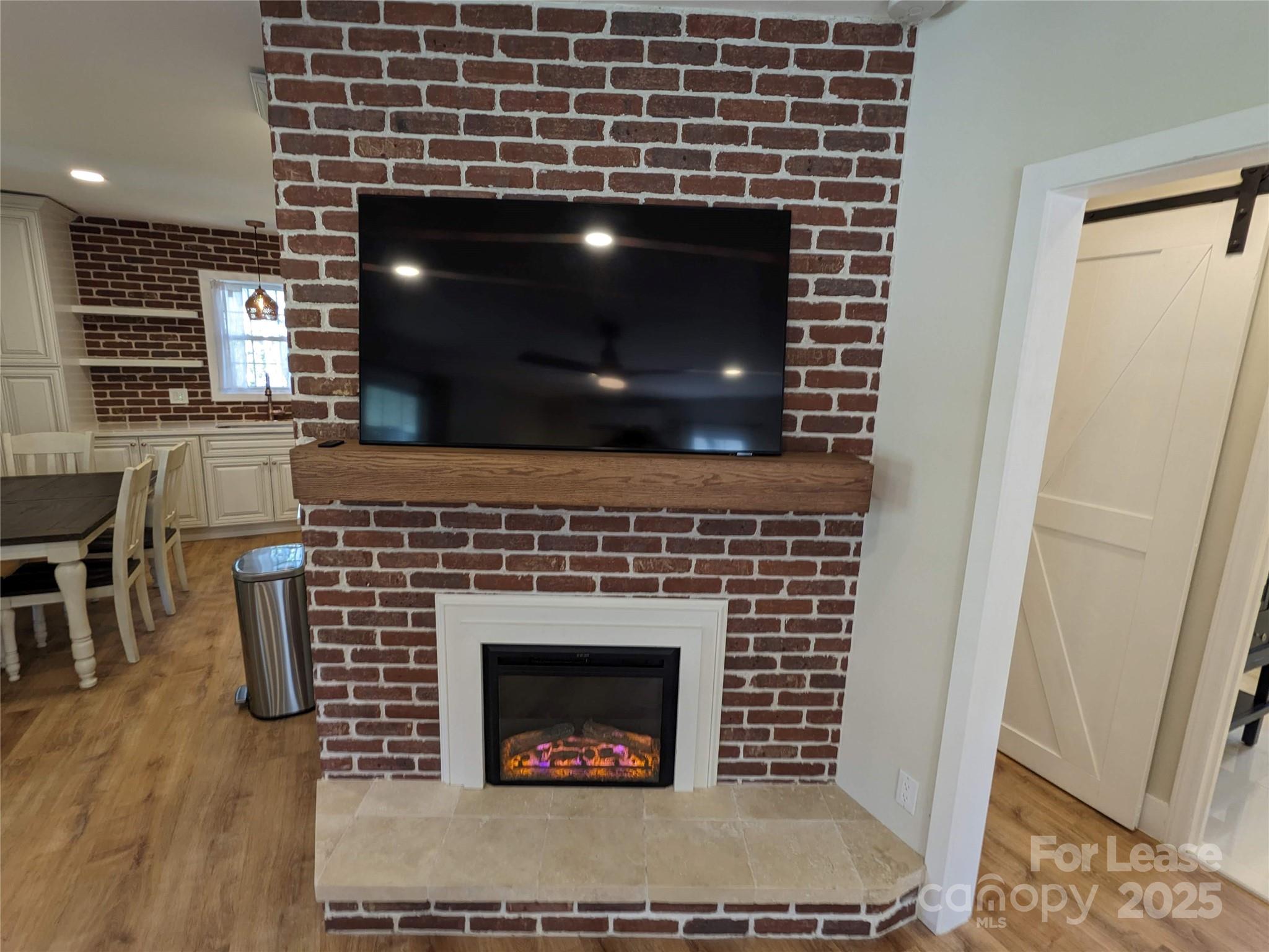 29 Woodrow Avenue, Unit 1 Asheville, NC 28801 - Photo 10 of 23 a living room with furniture and a fireplace