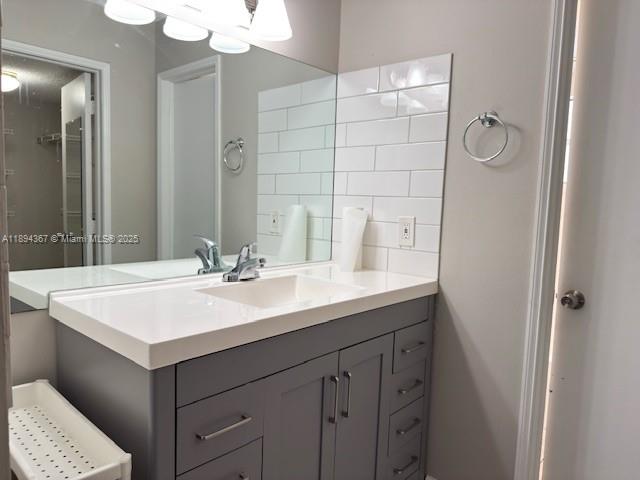 9441 Live Oak Place, Unit 207 Davie, FL 33324 - Photo 12 of 24 a bathroom with a sink vanity and a mirror