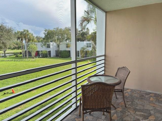 9441 Live Oak Place, Unit 207 Davie, FL 33324 - Photo 14 of 24 a view of a two chair in the patio